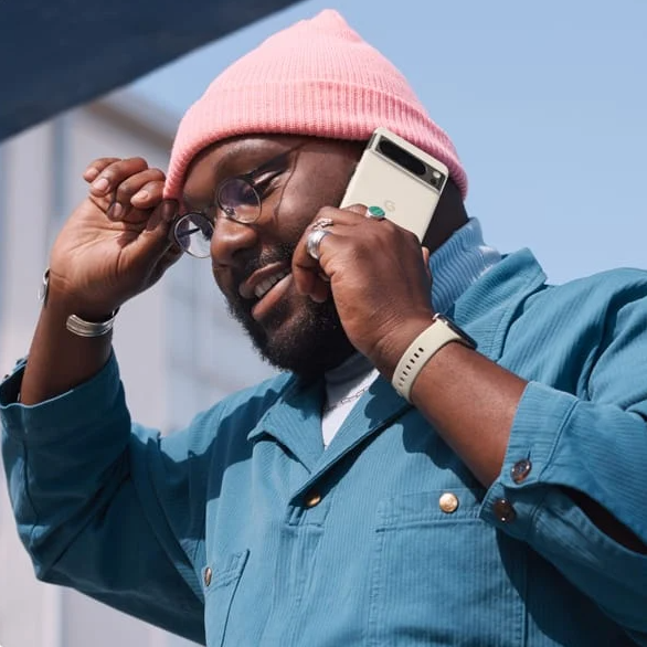 Black male holding Google Pixel 8 Phone